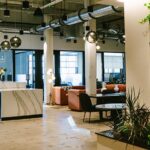 A communal area with multiple offices in the back