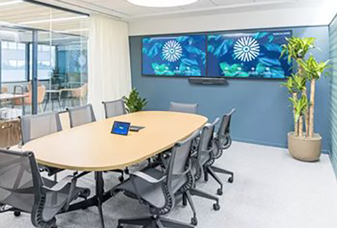 Meeting room with two TVs