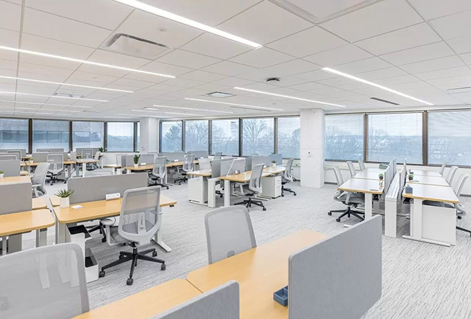 Large open plan office space with multiple desks