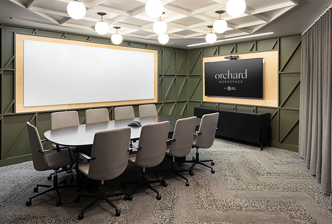 A meeting room with a whiteboard and tv