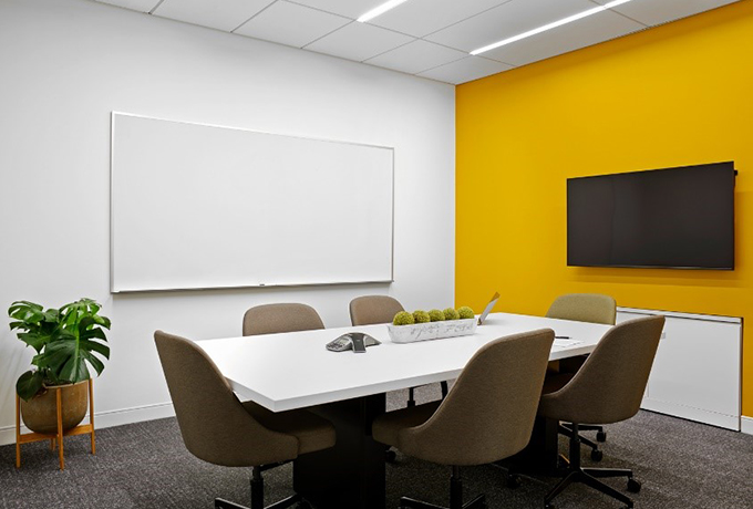 Small meeting room with whiteboard and TV