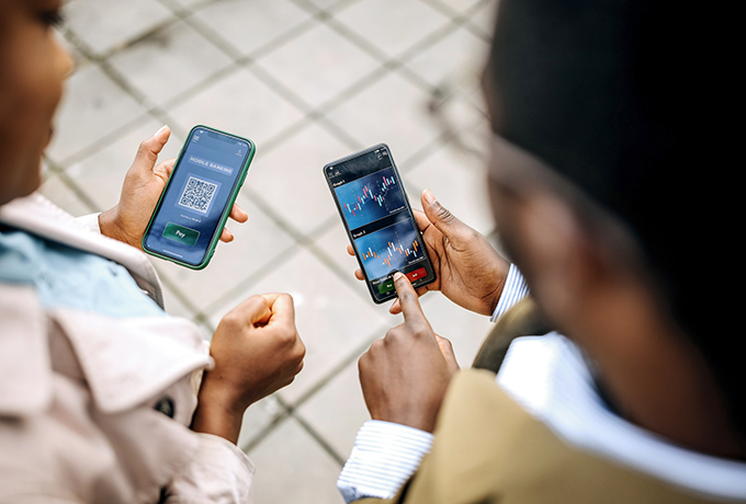 Two people talking with there phones out
