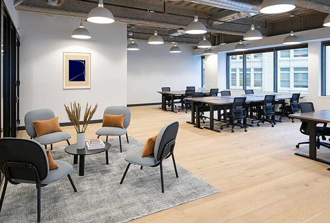 Open plan room with multiple desks and chairs