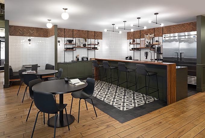 A kitchen with an area to sit and eat